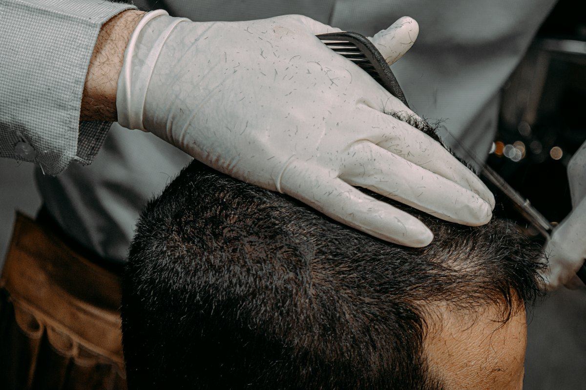 Stylist examining a client's scalp