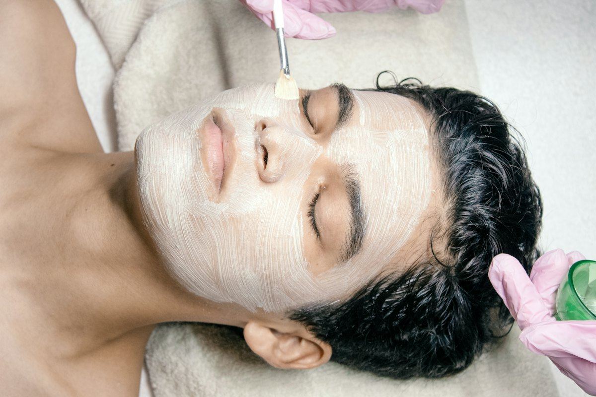 Man relaxing during a facial