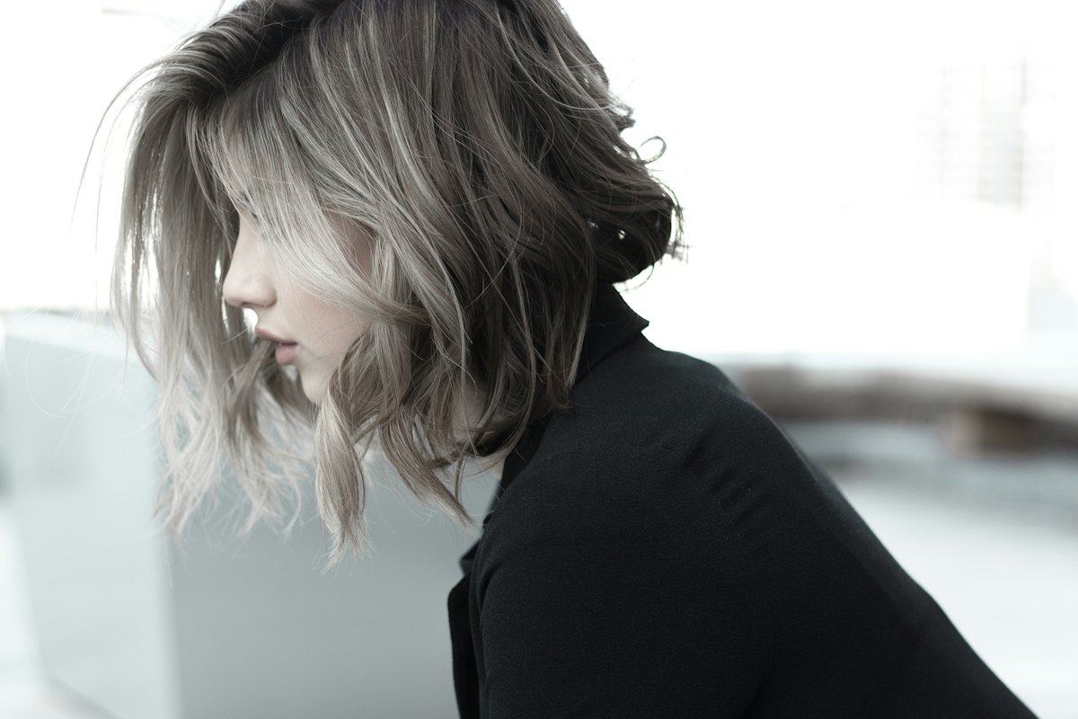 Shoulder-length hair with lighter highlights