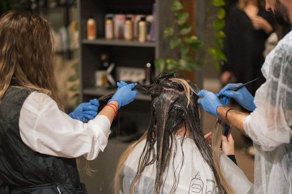 Stylists applying hair colour in a salon