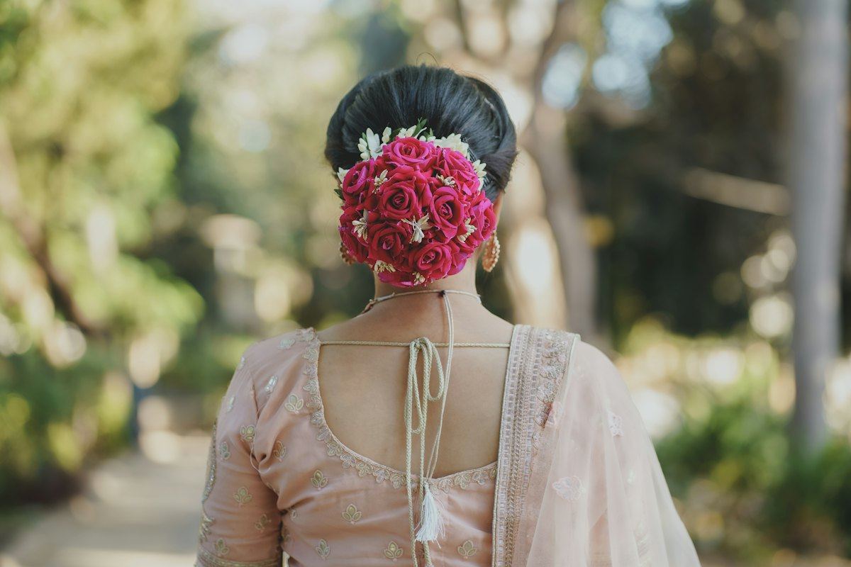 Bridal bun decorated with pink roses