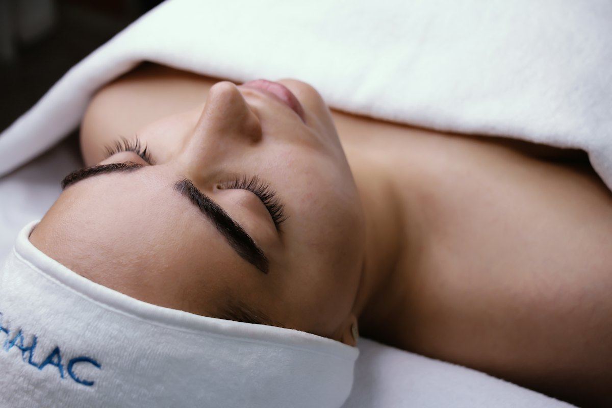 Woman relaxing during a facial